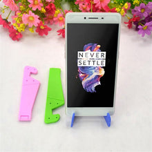 Load image into Gallery viewer, 288 Universal Phone Stand Foldable V Shape Mobile Mount Stand Holder Bracket (Random Color) (Pack of 4)